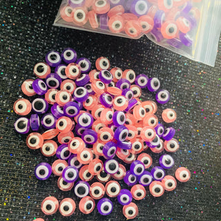 1 bag of purple pink eye Bead lot