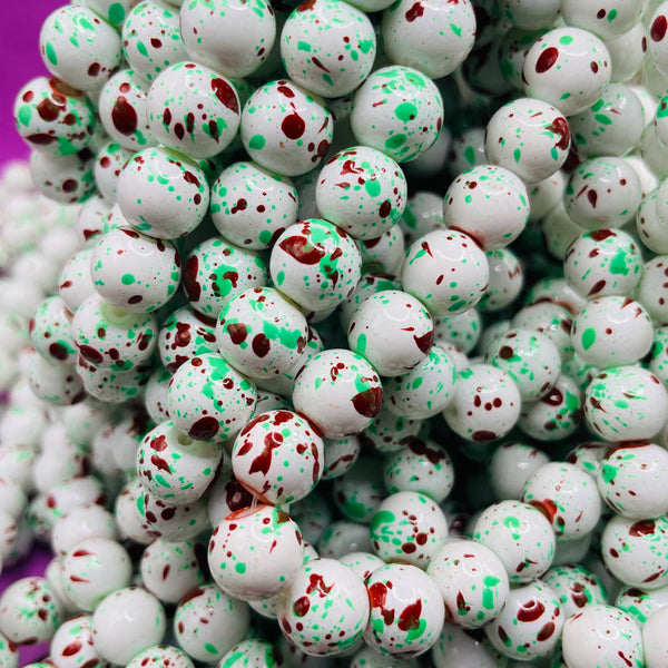 85 Piece 10MM glass bead strand dark red green white splatter