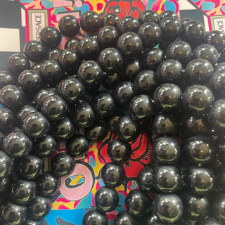 Glass 1 strand 12MM bead black-May include some imperfect beads