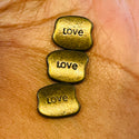 10 piece Love Word Bronze Beads